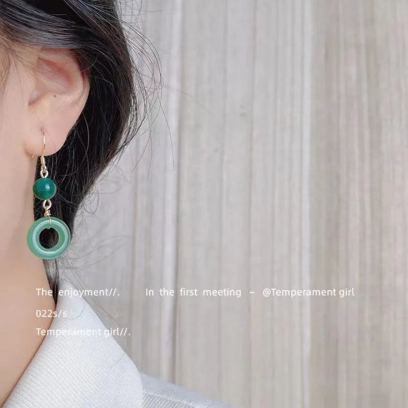 Green Chinese style peace buckle motif earrings with geometry shape and ring design elements