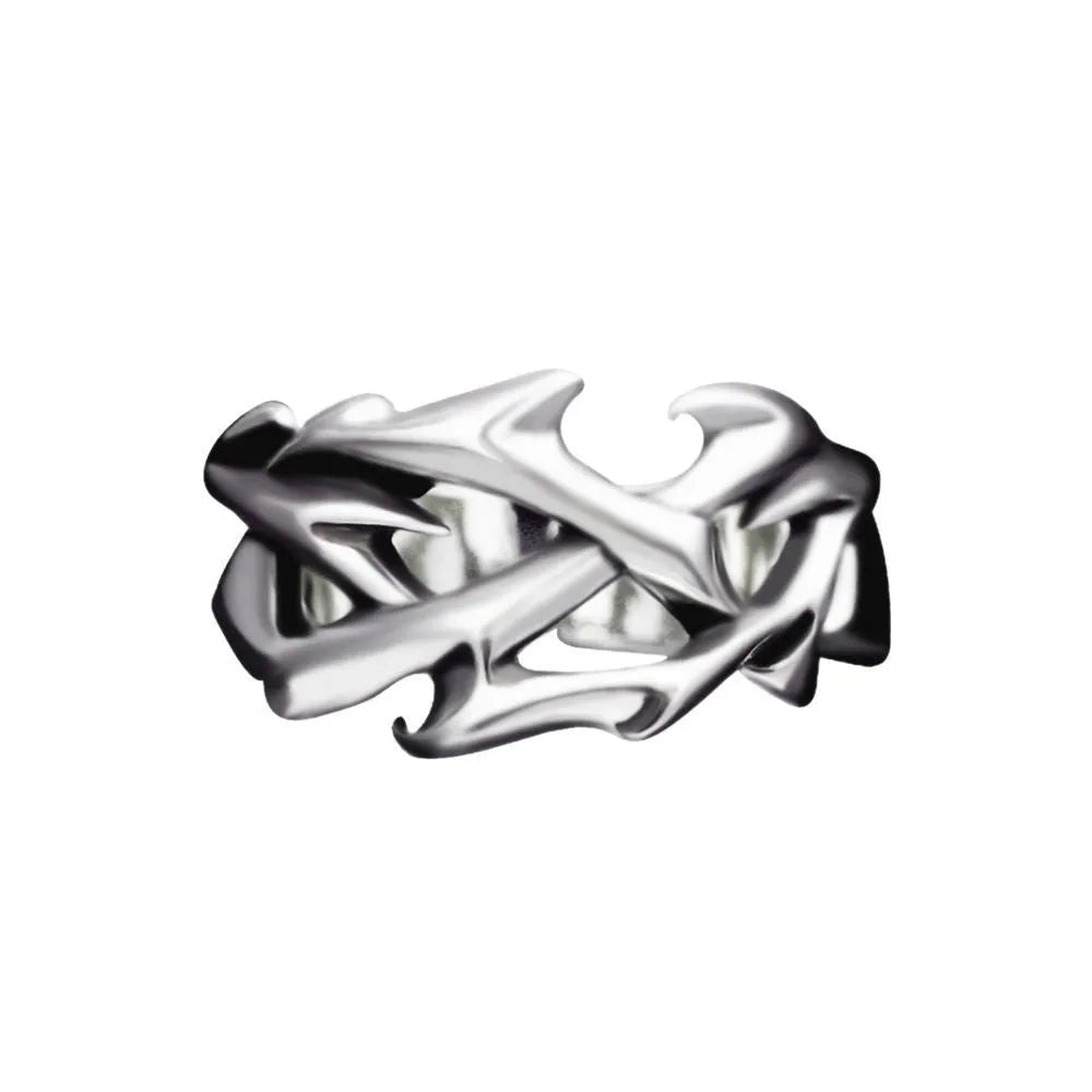 Copper thorn flower geometric ring with adjustable opening on a flat surface.
