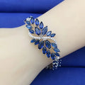Gold electroplated bracelet with colourful zircon stones and ice flower pattern detailing on copper base
