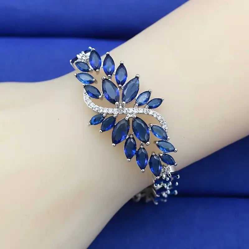 Gold electroplated bracelet with colourful zircon stones and ice flower pattern detailing on copper base