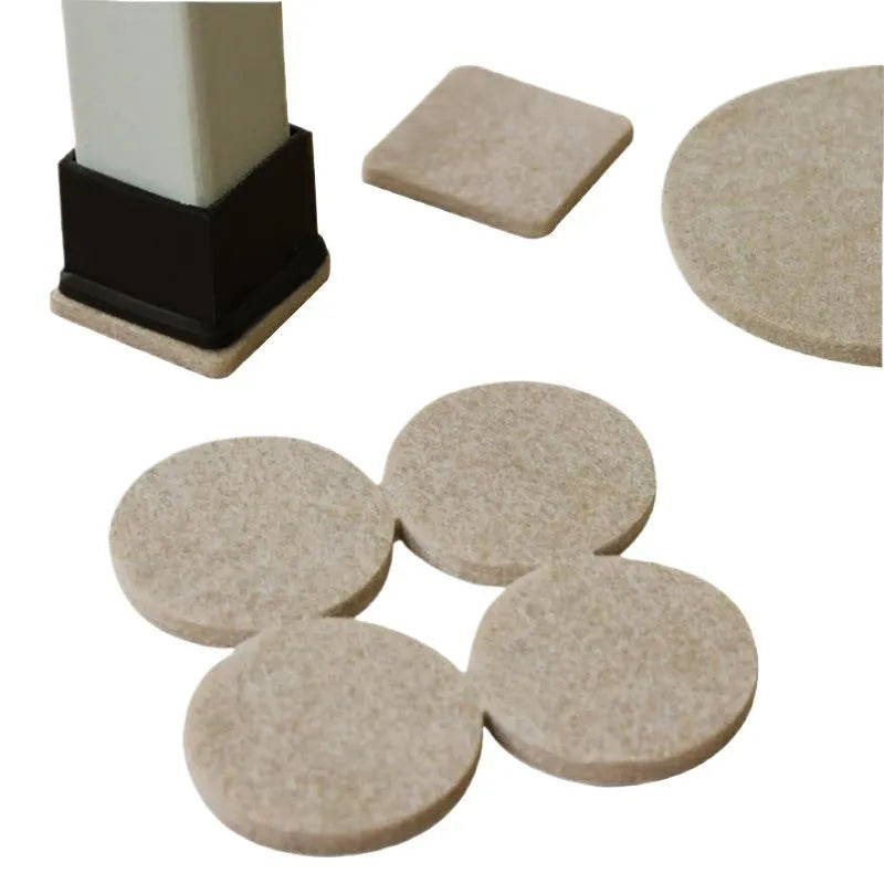 Assortment of beige plastic furniture leg protector pads in round and square shapes on a floor