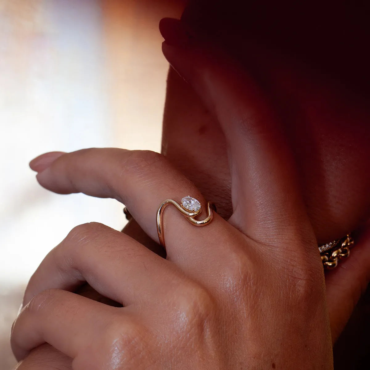 Men's geometric titanium steel zircon ring on a hand, showing no-fading stainless steel construction.