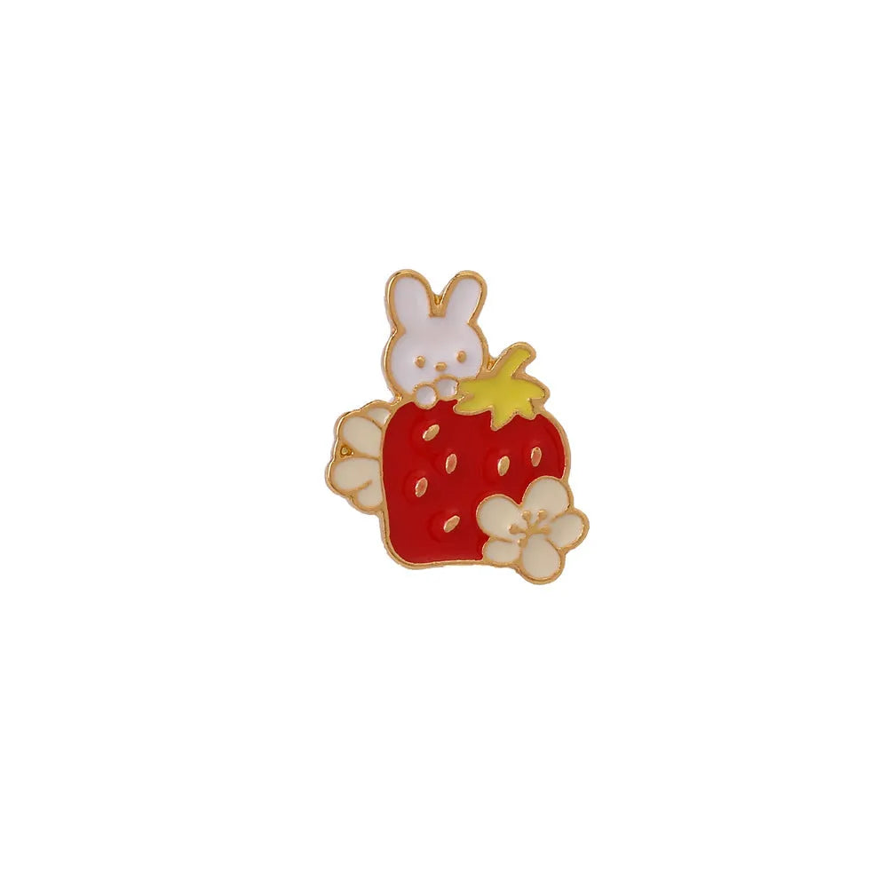 Alloy metal brooch showing a cute cat figure with a strawberry cake and dripping oil decoration.