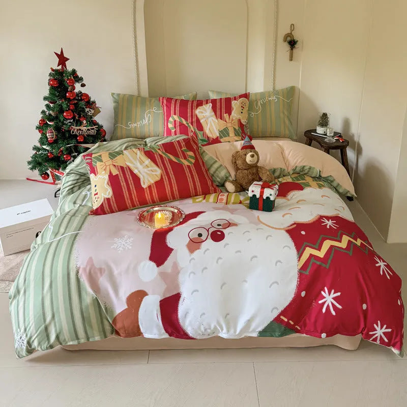 Christmas cartoon themed four-piece bedding set with duvet cover, fitted sheet and pillowcases on a bed.