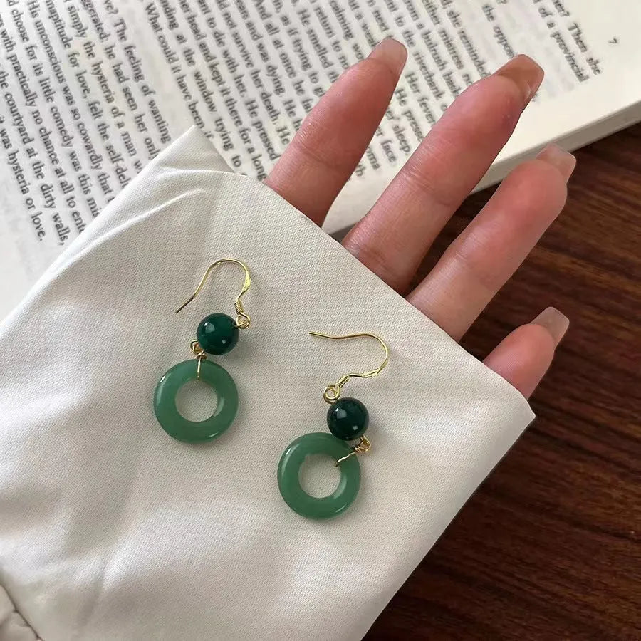 Green Chinese style peace buckle motif earrings with geometry shape and ring design elements