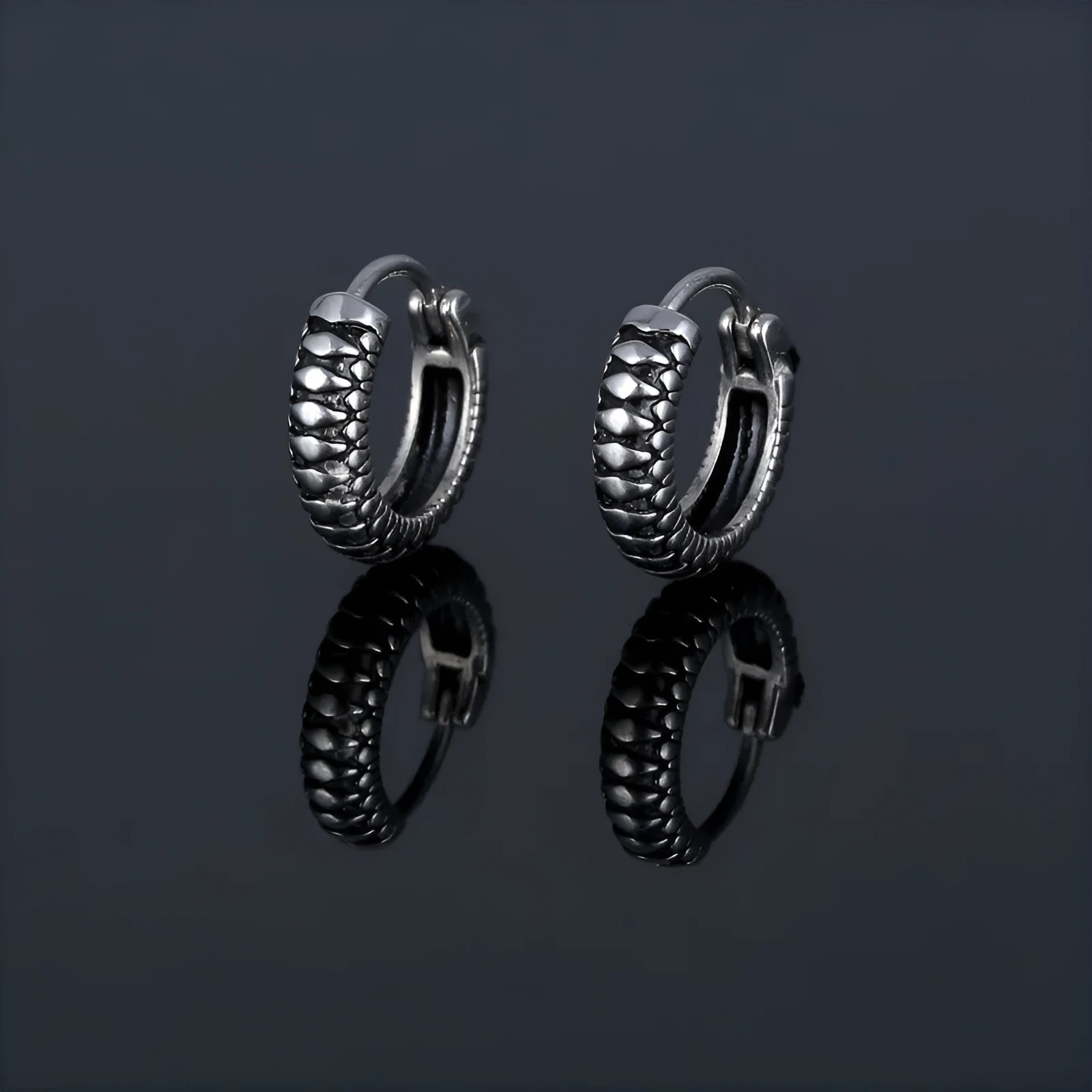 Silver geometric retro twist earrings made from titanium steel alloy with stripe detailing.