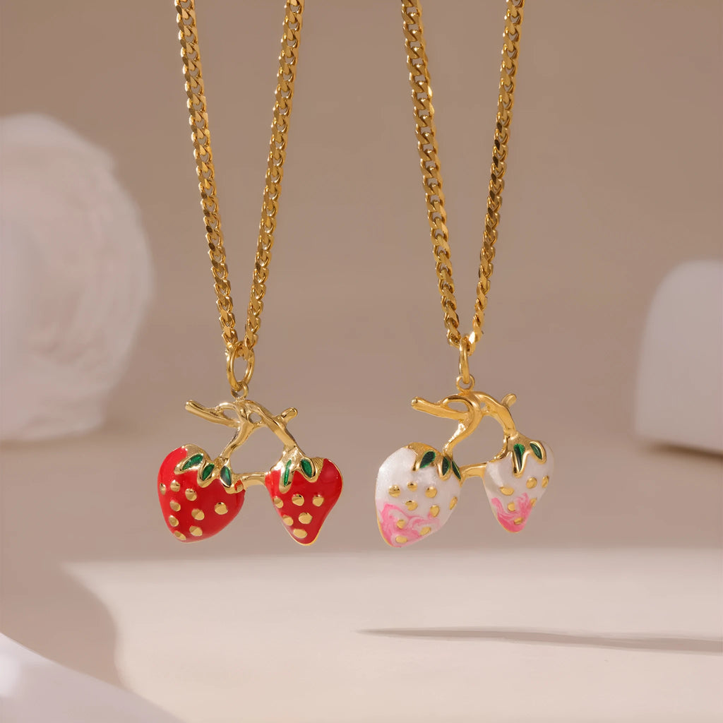 Stainless steel strawberry fruit pendant necklace for women showing red and white gradient colour options