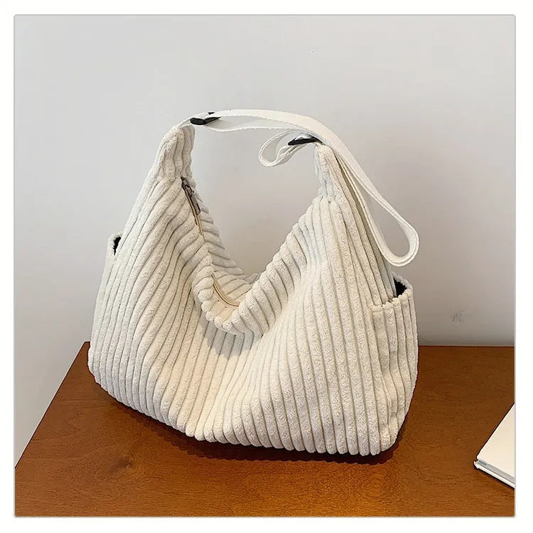 Corduroy crossbody bag in black, white or grey with single strap and sandwich pocket