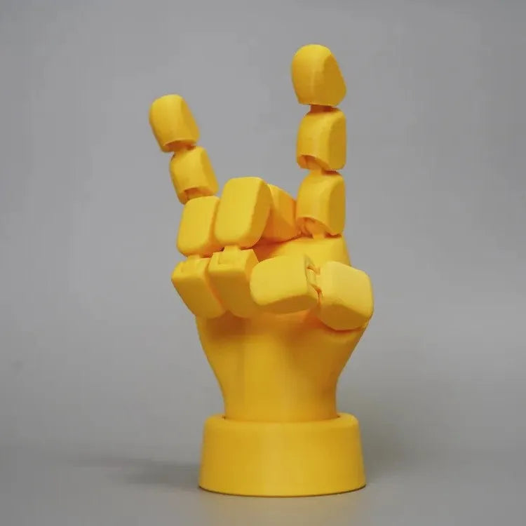 Yellow PLA movable joint hand props for stop motion animation measuring 5x5.38x7.5cm