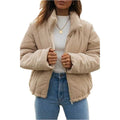 Apricot coloured women's corduroy zip jacket with stand collar and long sleeves on a hanger.