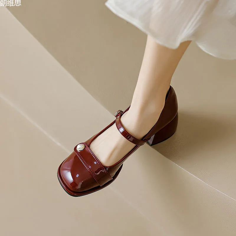 Women's patent leather ankle boots with chunky heels and square toe in apricot colour with buckle fastening