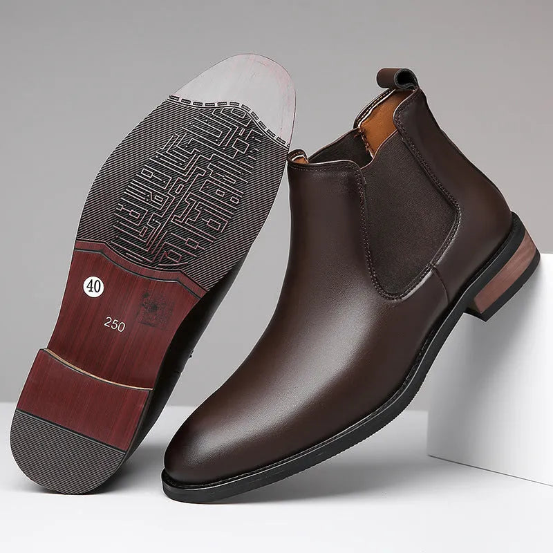 Men's black pointed-toe Chelsea boots with a high-top, mid-calf design and a low rubber sole.
