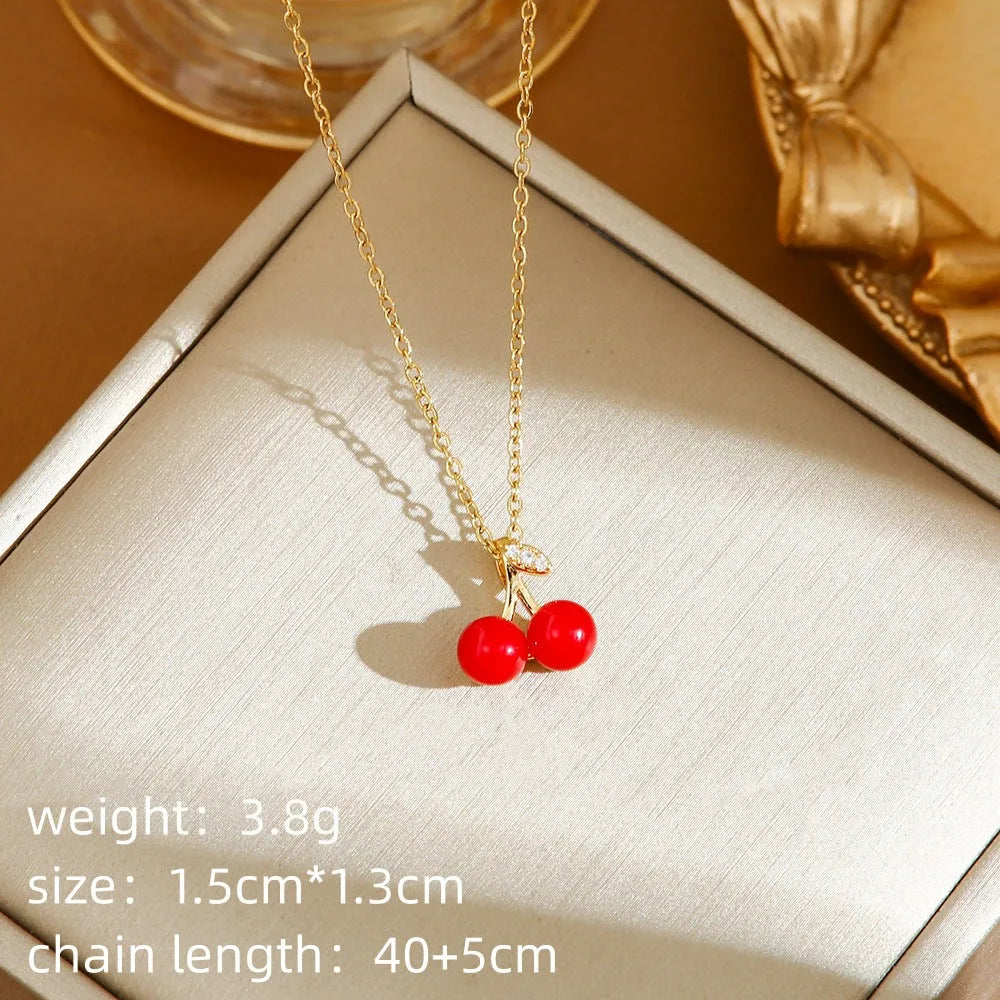 Titanium steel women's necklace with fruit pendant on O-ring chain in golden and steel colour options