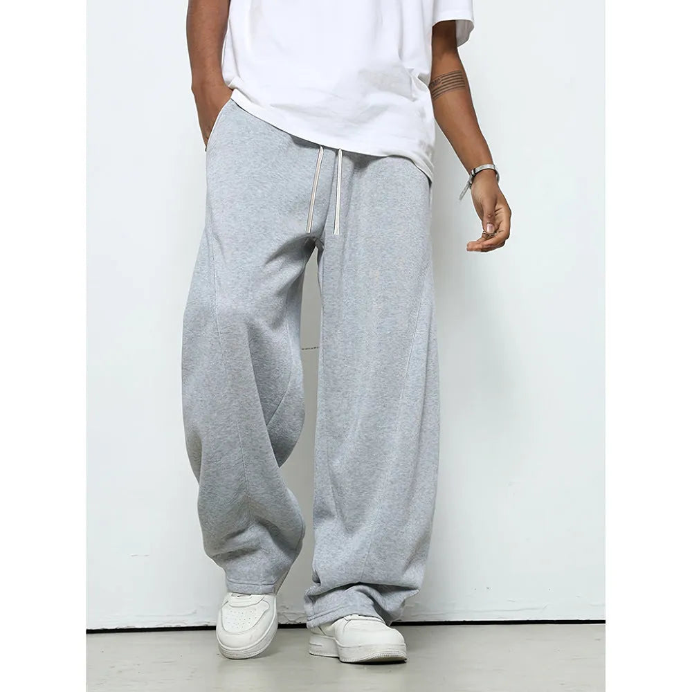 Men's solid colour casual trousers with a micro-elastic waistband and straight-leg cut.