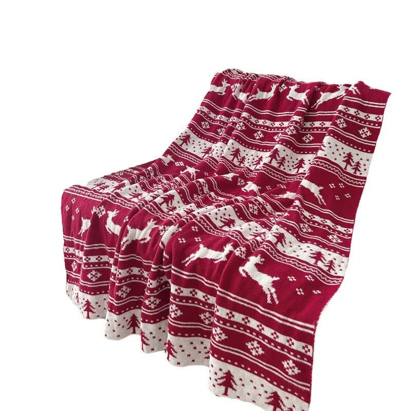 Personalised Christmas acrylic blanket with snowflake design draped over a sofa
