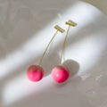 Juicy Peach fruit-shaped acrylic earrings on copper posts, shown in small and large size variants.