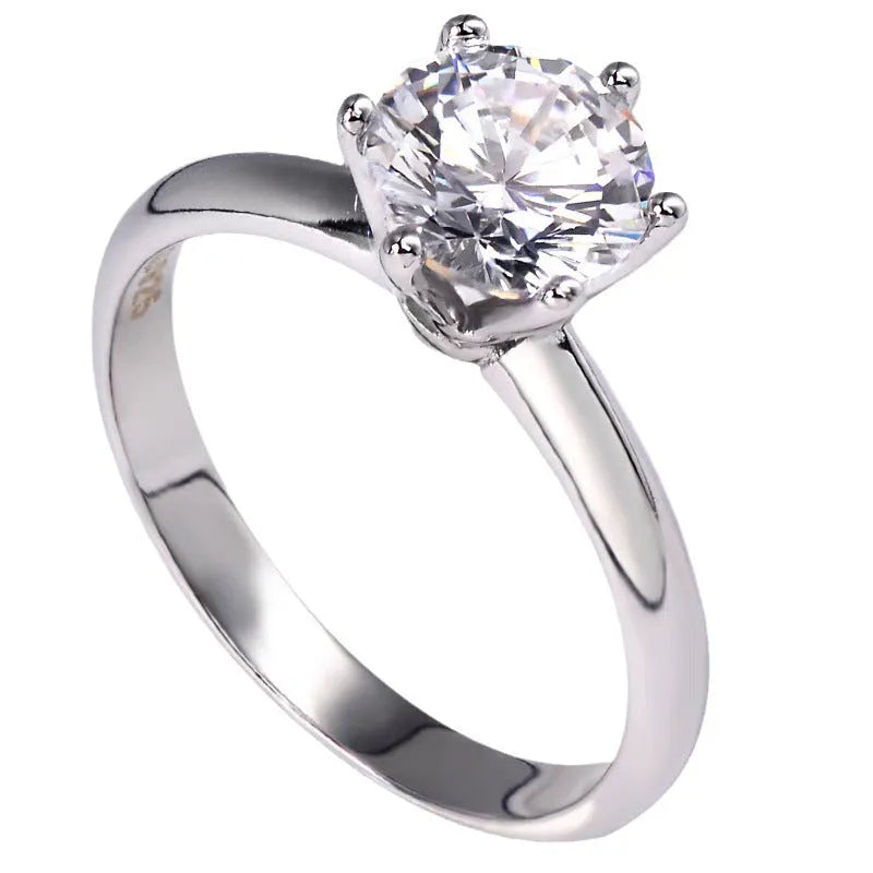 White gold plated women's ring with six-claw zircon setting and geometric band design