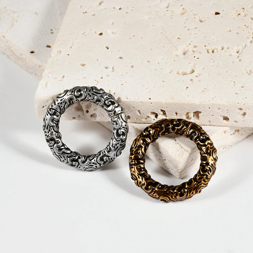 Stainless steel fashion earrings with a totem pattern design in one of 15 electroplated colour options