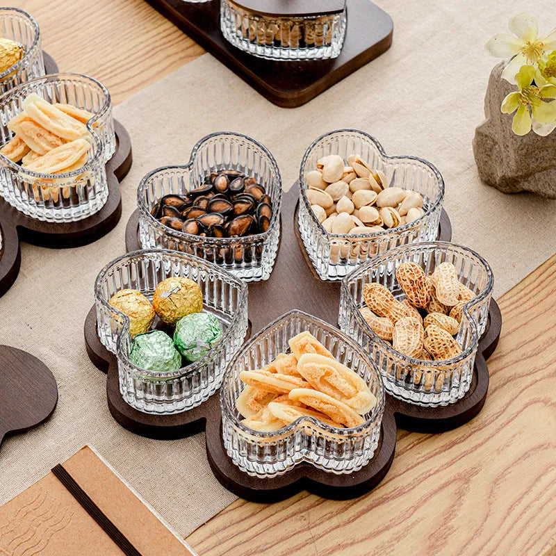 Glass snack platter with choice of 2, 3, 4, or 5 transparent heart-shaped bowls with lids on an irregular tray.