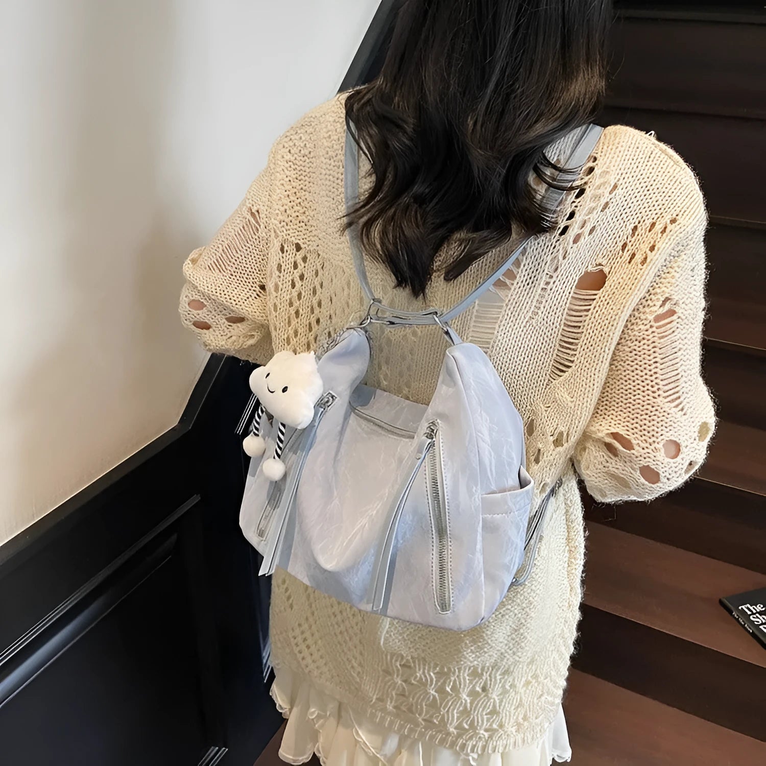 Women's soft PU leather fashion backpack in black, white, silver, or blue colour with pendant accessory