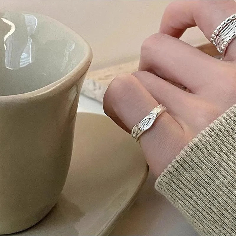 Women's geometric ring with woven twisted multilayer design and adjustable opening