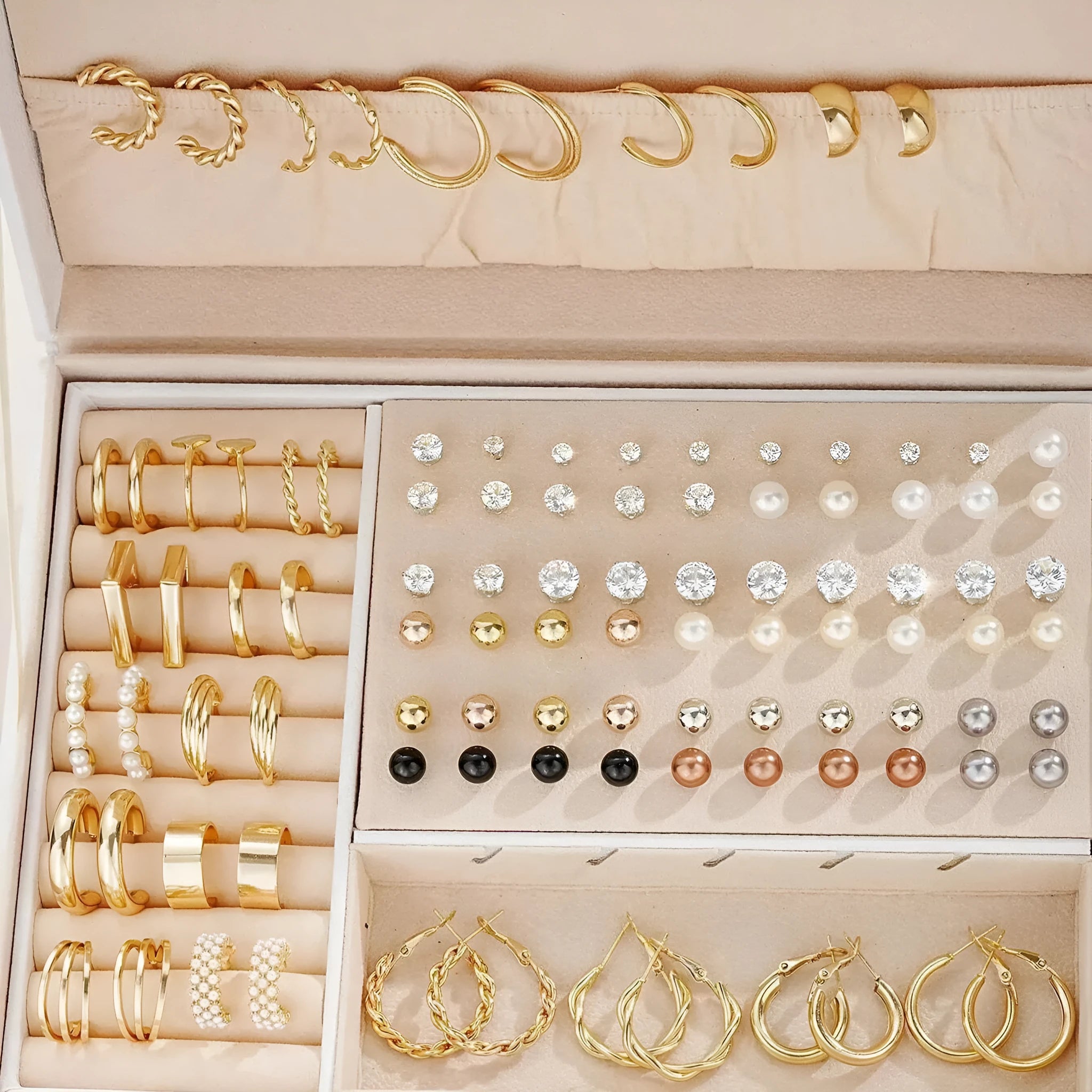 108 gold and yellow geometric alloy earrings with round bead details laid out flat.