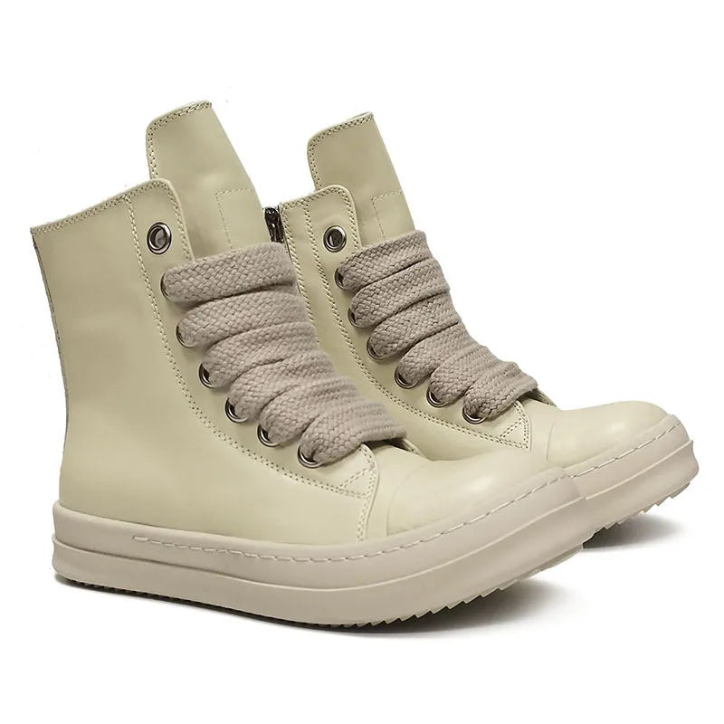 Black high-top leather sneakers with a side zipper and round toe on a rubber sole.