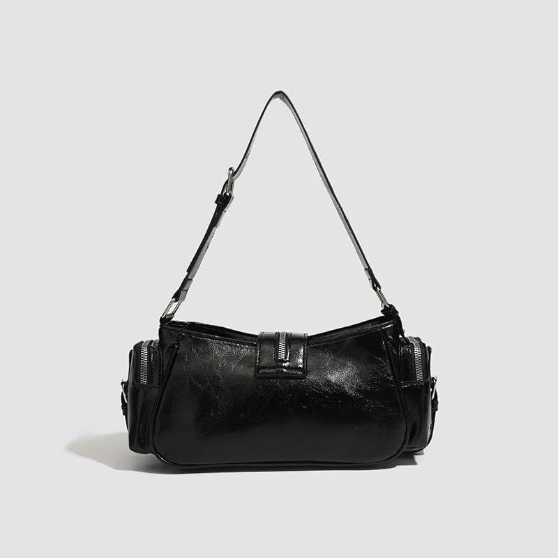 Black retro dumpling-shaped handbag with oil wax leather exterior and multiple internal compartments