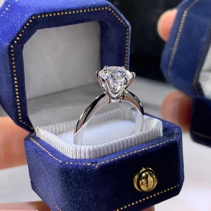 White gold plated women's ring with six-claw zircon setting and geometric band design