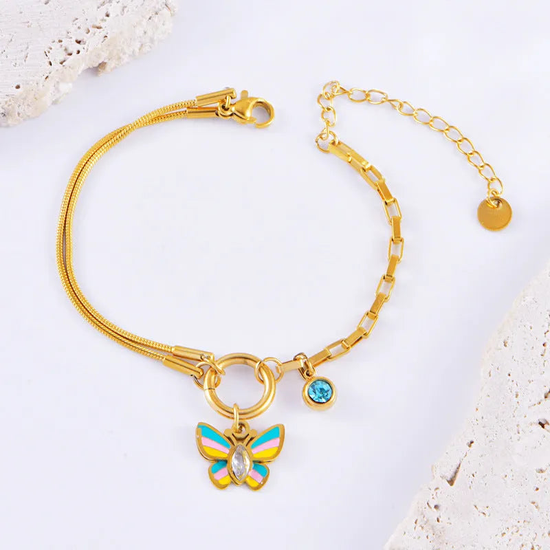 Gold titanium steel necklace and bracelet set with colourful epoxy butterfly pendant on snake bone chain.