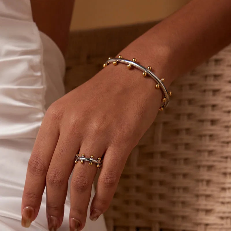 Stainless steel C-shaped bean bead bracelet with personality texture rivet design in gold finish