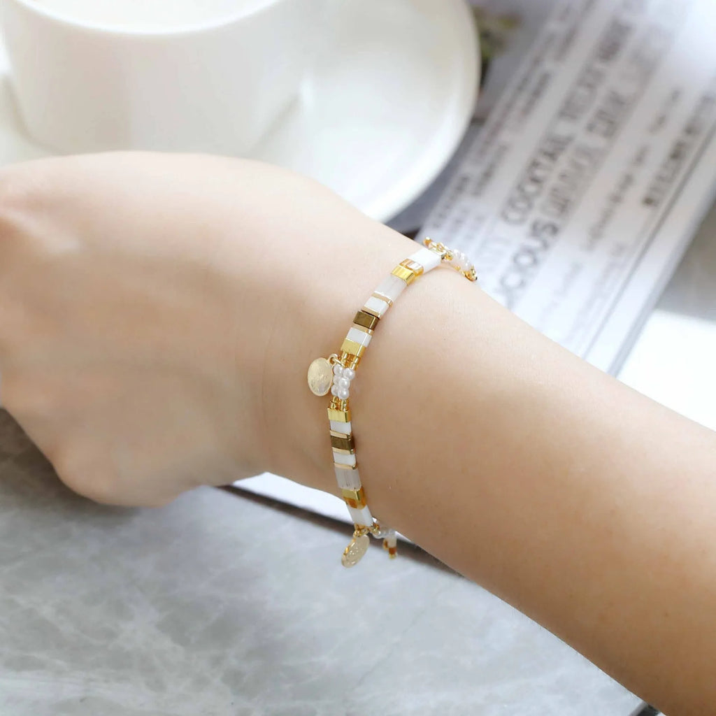 Women's handcrafted bracelet with imitation pearl beads in a European/American style design.