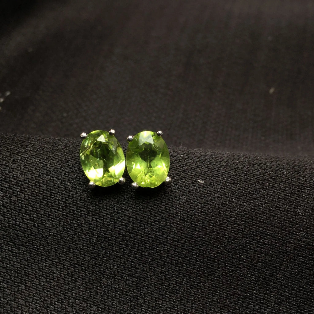 Grass green natural olivine oval stone stud earrings in S925 sterling silver.