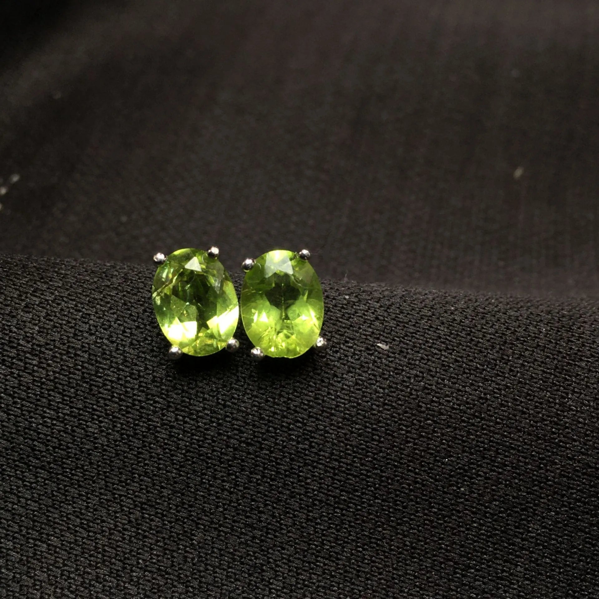 Grass green natural olivine oval stone stud earrings in S925 sterling silver.