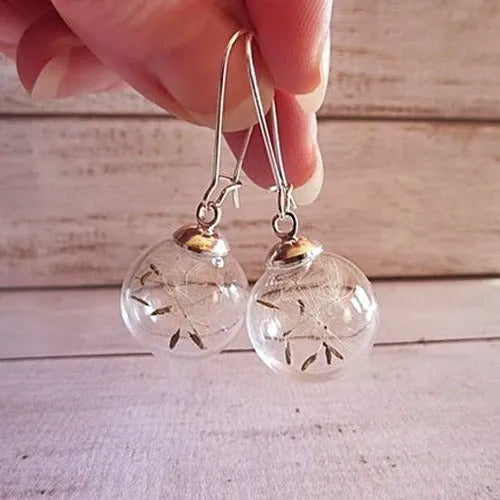 Transparent glass ball earrings with dandelion seed design on silver French hooks
