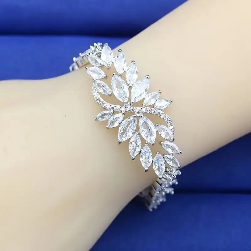 Gold electroplated bracelet with colourful zircon stones and ice flower pattern detailing on copper base