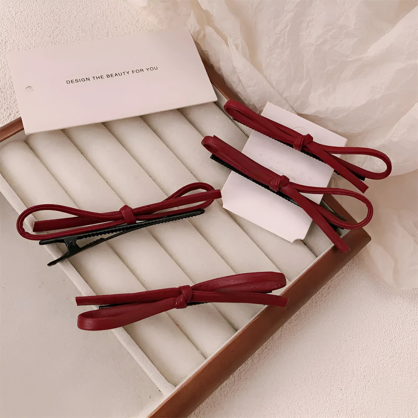 Wine red leather bow barrette hair clip for women showing manual crafted detail