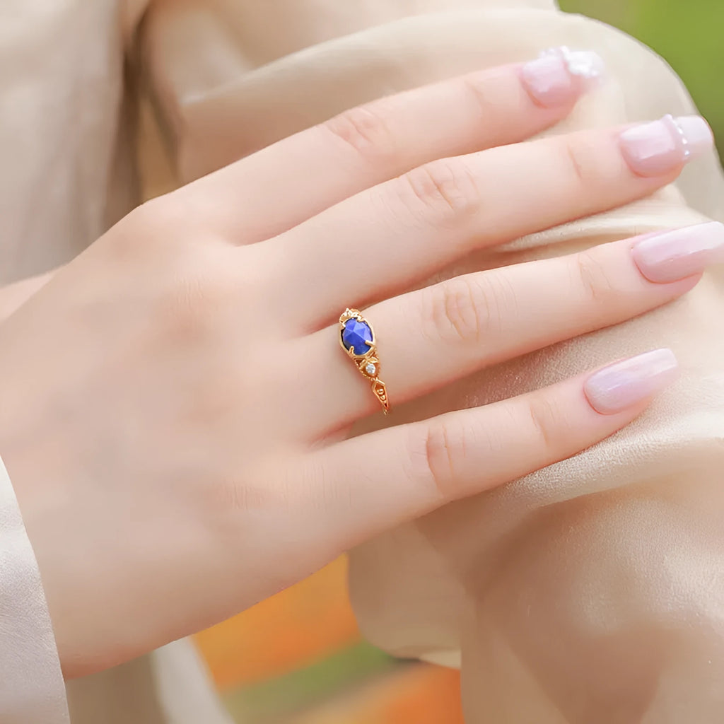 Geometric ellipse silver alloy ring with a round blue lapis lazuli stone, Japanese style design.