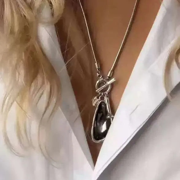 Women's geometric alloy pendant necklace with snake bones chain in blue, champagne, or grey.