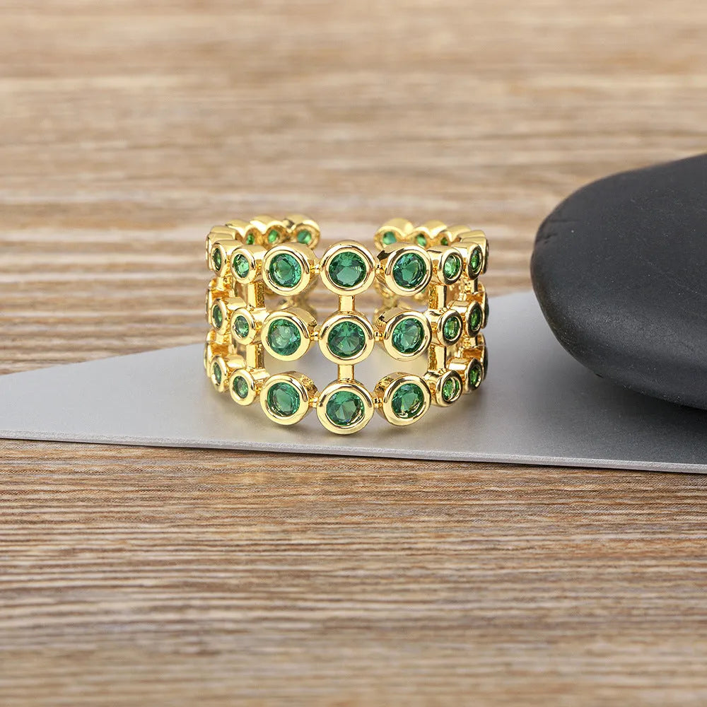 Copper 18K gold plated three-layer ring with green zircon stones in wide band unisex design
