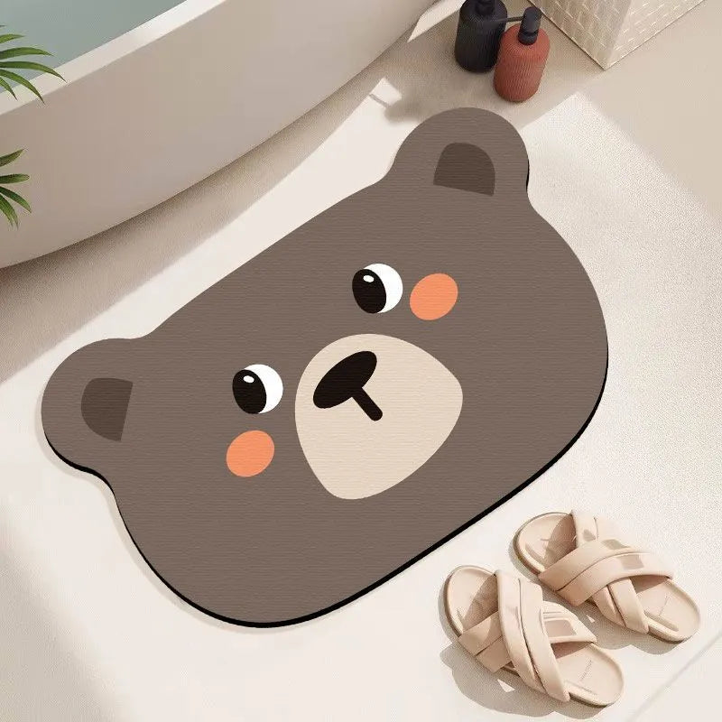Cartoon animal diatom ooze absorbent bathroom mat in alien shape on bathroom floor.