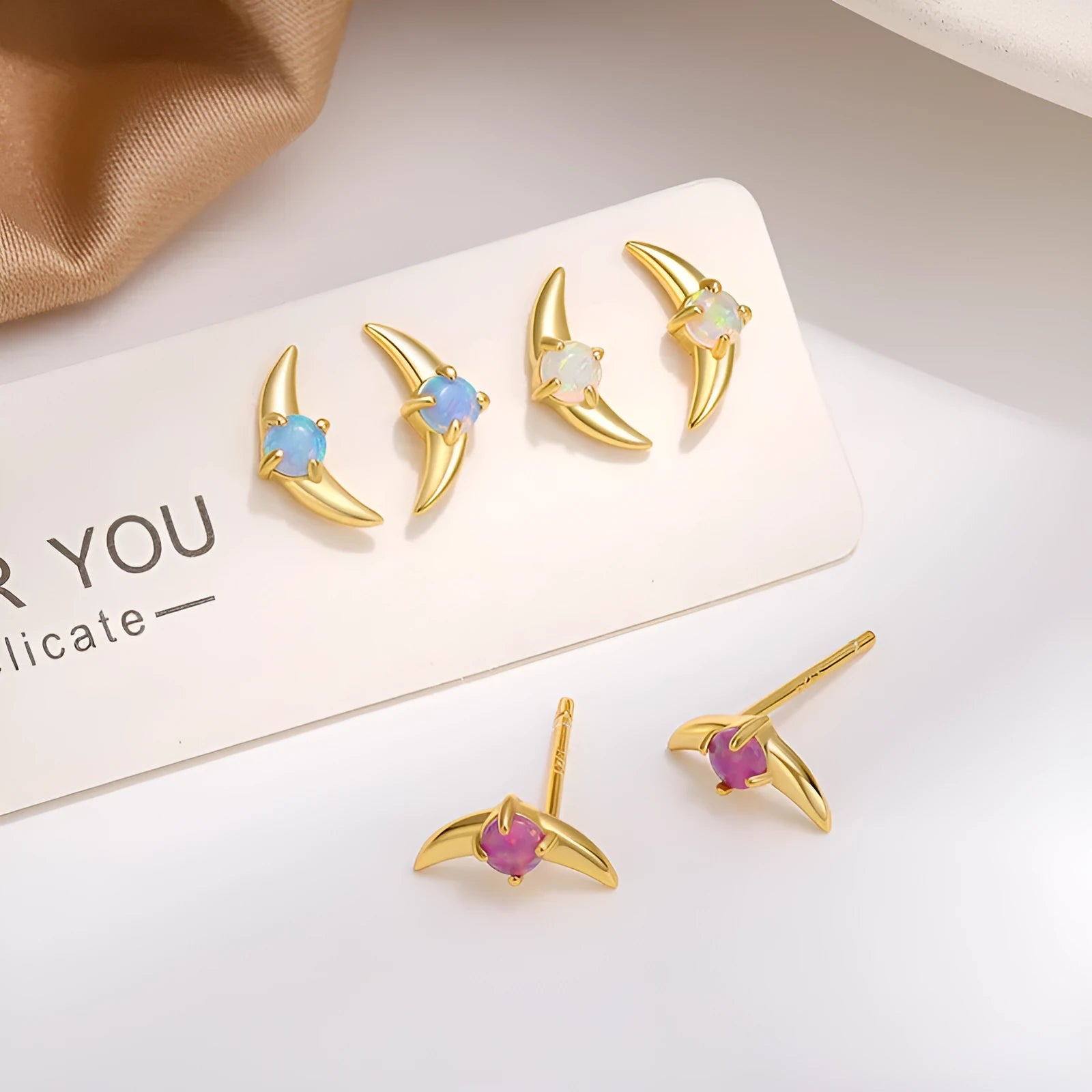925 sterling silver geometric earrings with electroplated finish and stone accents in gold or platinum colour options