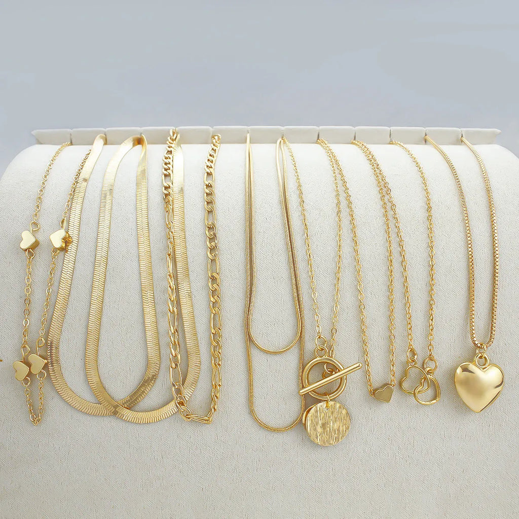 Gold electroplated women's necklace jewellery set with snake chain construction and alloy pendants