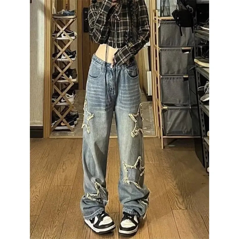 Blue women's high waist straight-leg jeans made from cotton denim on a neutral background.