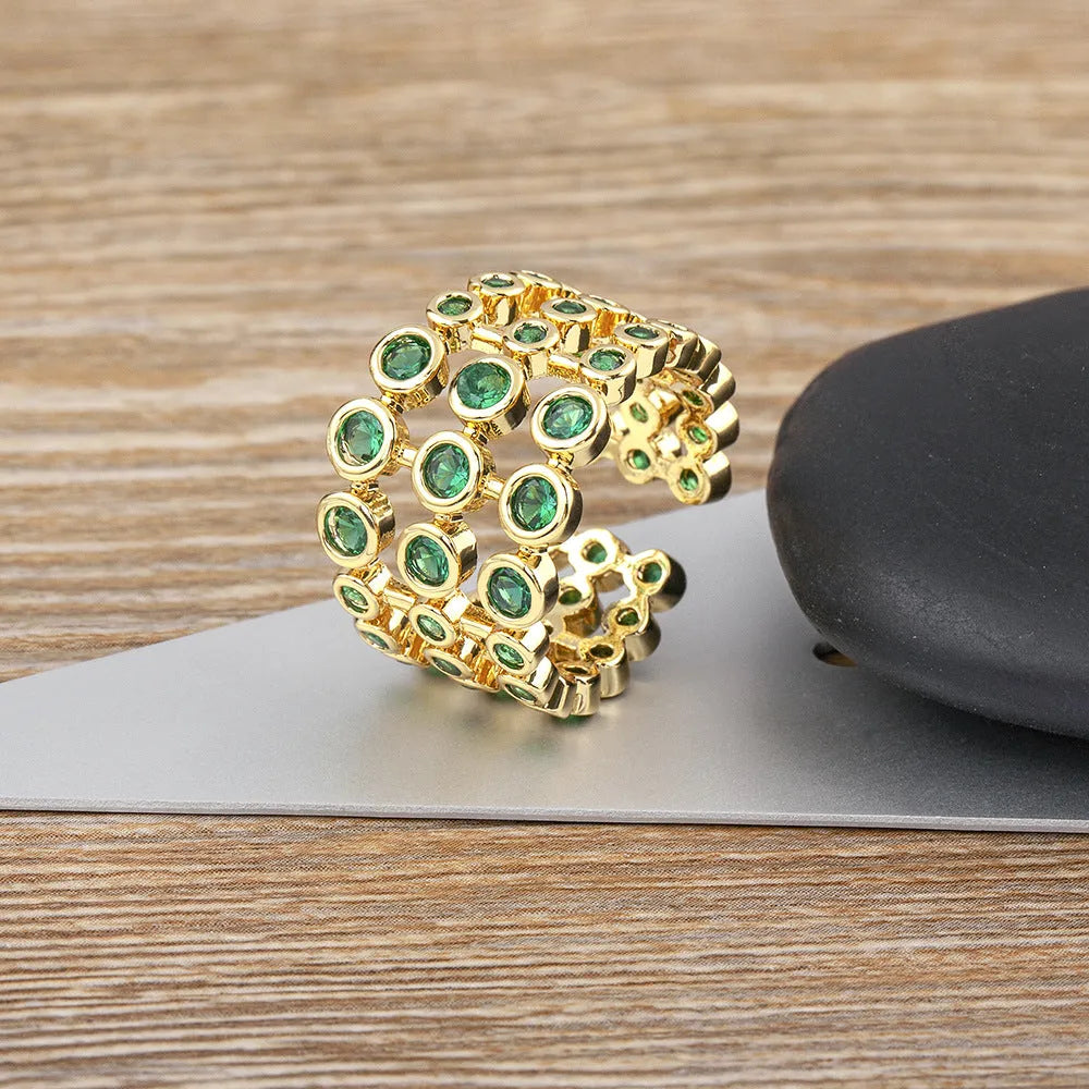 Copper 18K gold plated three-layer ring with green zircon stones in wide band unisex design