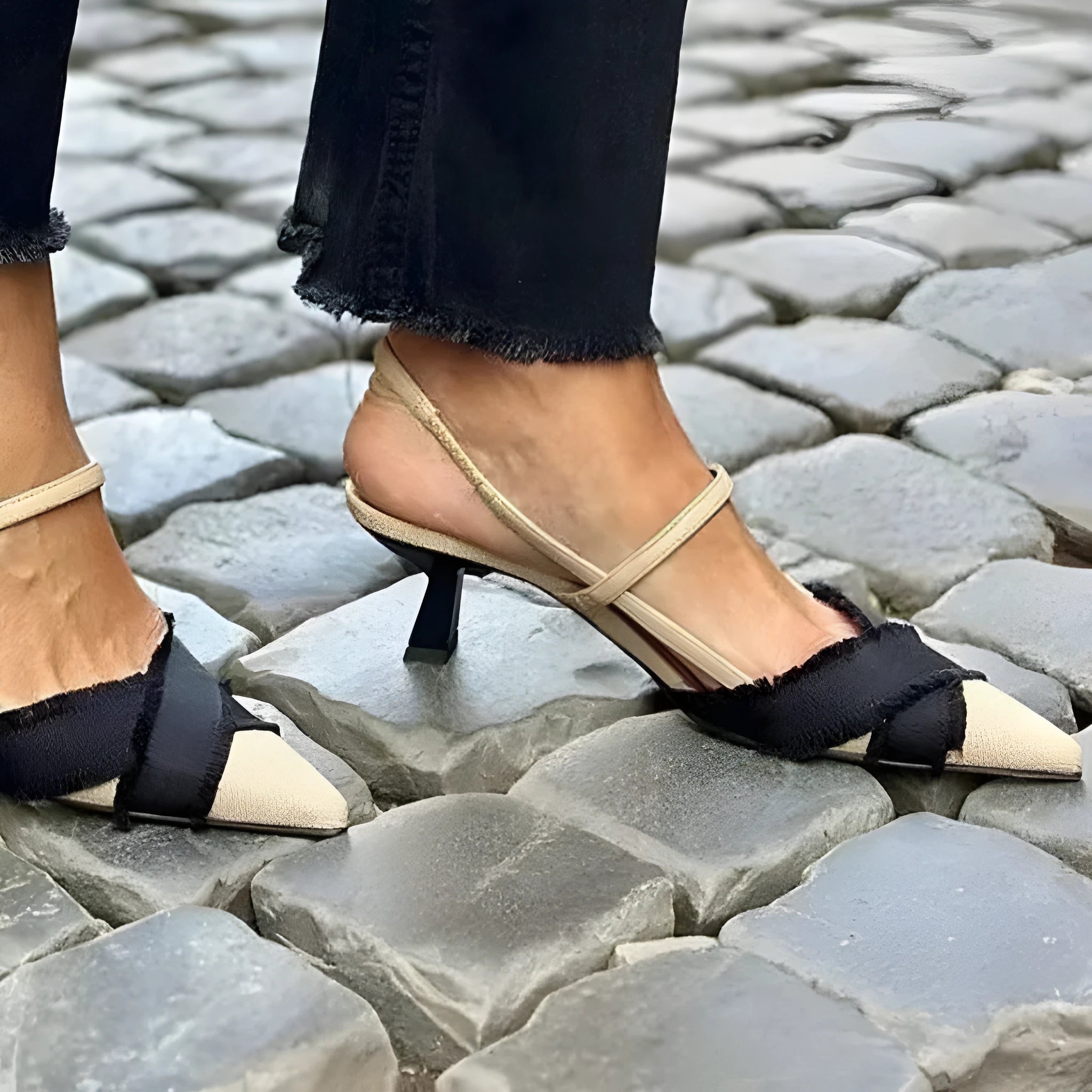 Apricot black women's stiletto heel sandals with pointed toe and buckle fastening on a rubber sole.