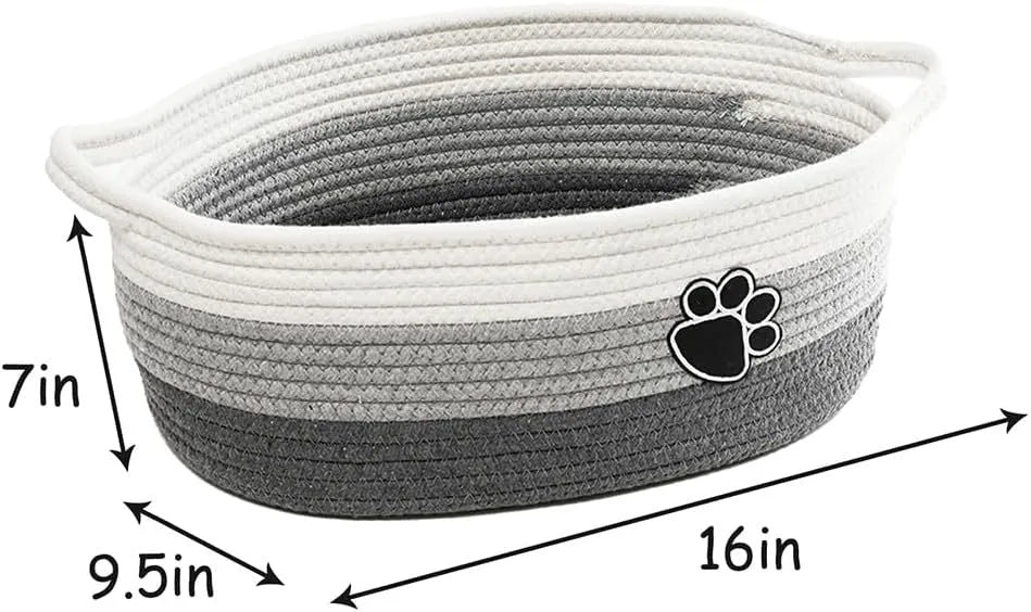Handmade light beige woven cotton rope storage basket with a wooden handle.