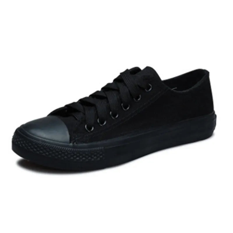 Women's casual lace-up canvas shoes in solid colours on a white background.