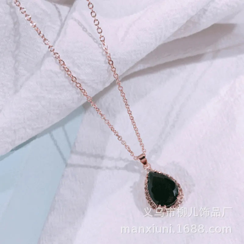 Rose gold water drop necklace with geometric rhinestones in pink colour