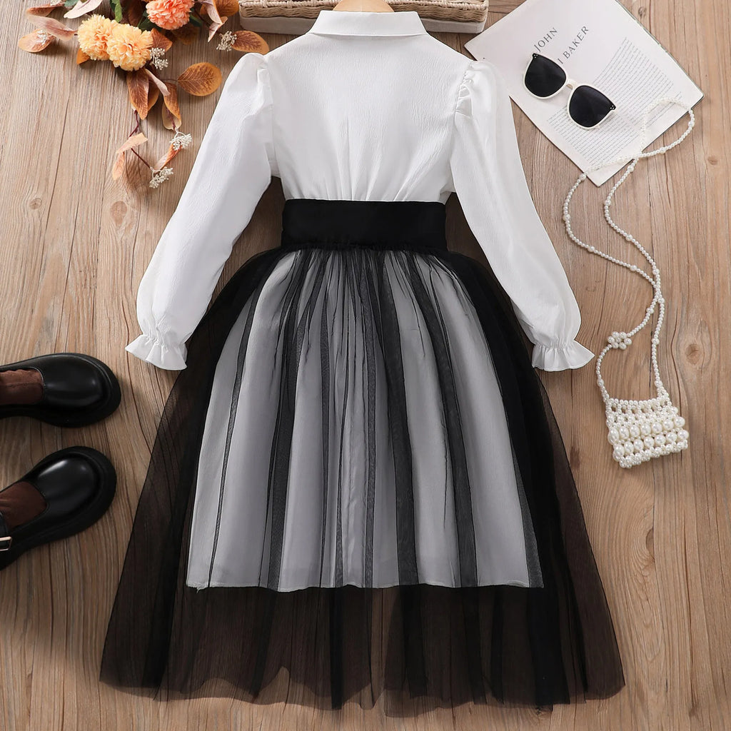 Solid colour girls dress with mesh stitching detail in black